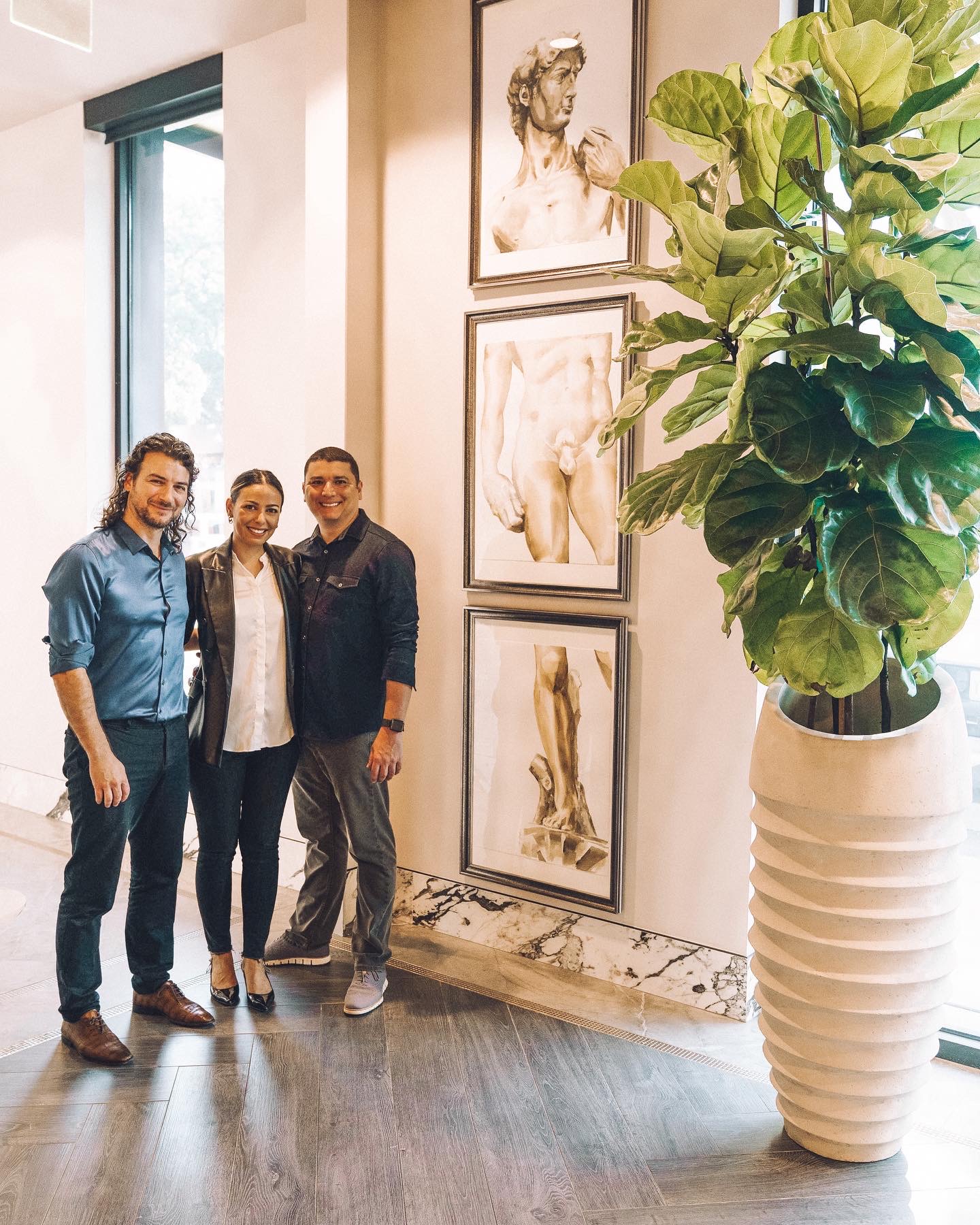 A beautiful watercolor triptych of Michelangelo's famous statue of David, now on display at Priano in Tampa, Florida, with the owners.