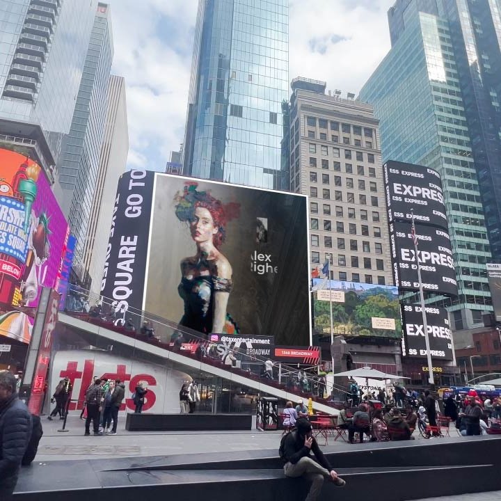 A digital art piece titled 'Mona Lisa's Daughter' by Alex Righetto, featuring a modern interpretation of the classic Mona Lisa, displayed on a large screen in the vibrant and crowded Times Square.