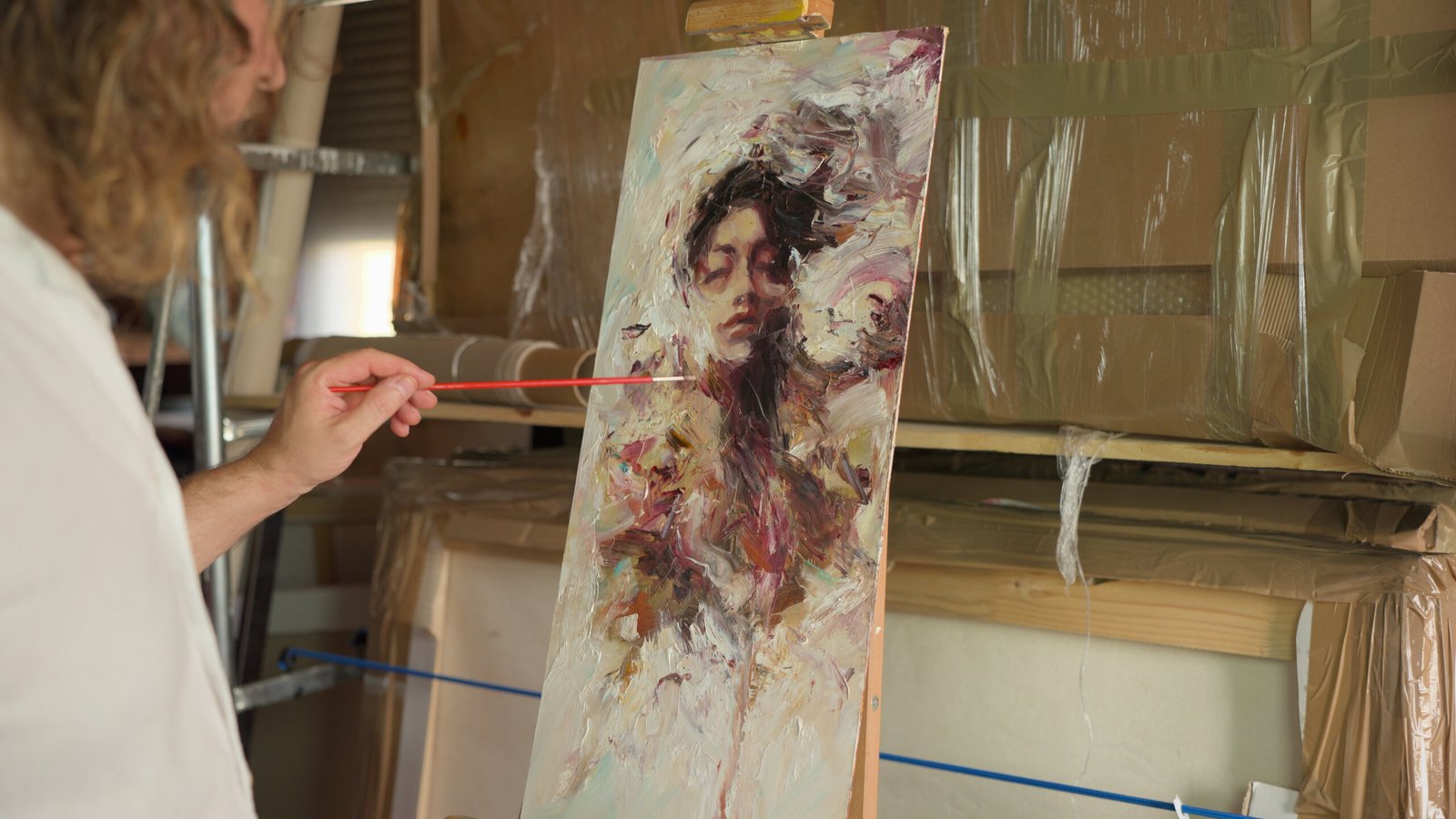 Alex at work in his studio, painting the donated artwork.