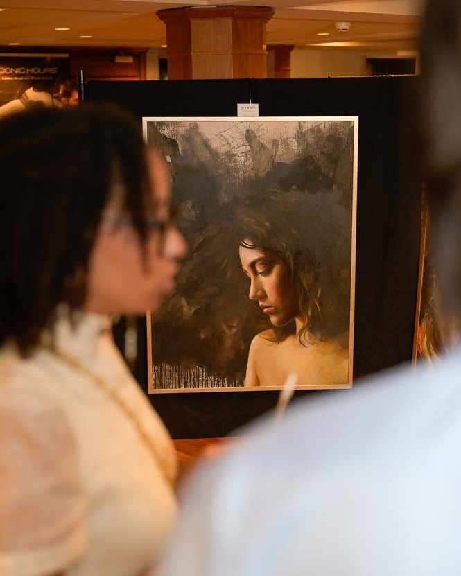 Romeo & Juliet: The Metamorphosis at Art & Luxury Monaco 5 Visitors viewing a painting from Alex Righetto’s Romeo & Juliet: The Metamorphosis collection at Art & Luxury Monaco 2026.